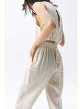 a woman with brown hair wears the ikikiz crinkle slouchy pants + top in cream cotton gauze
