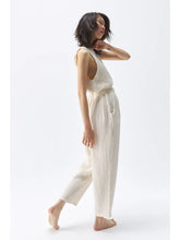 a woman with brown hair wears the ikikiz crinkle slouchy pants + top in cream cotton gauze
