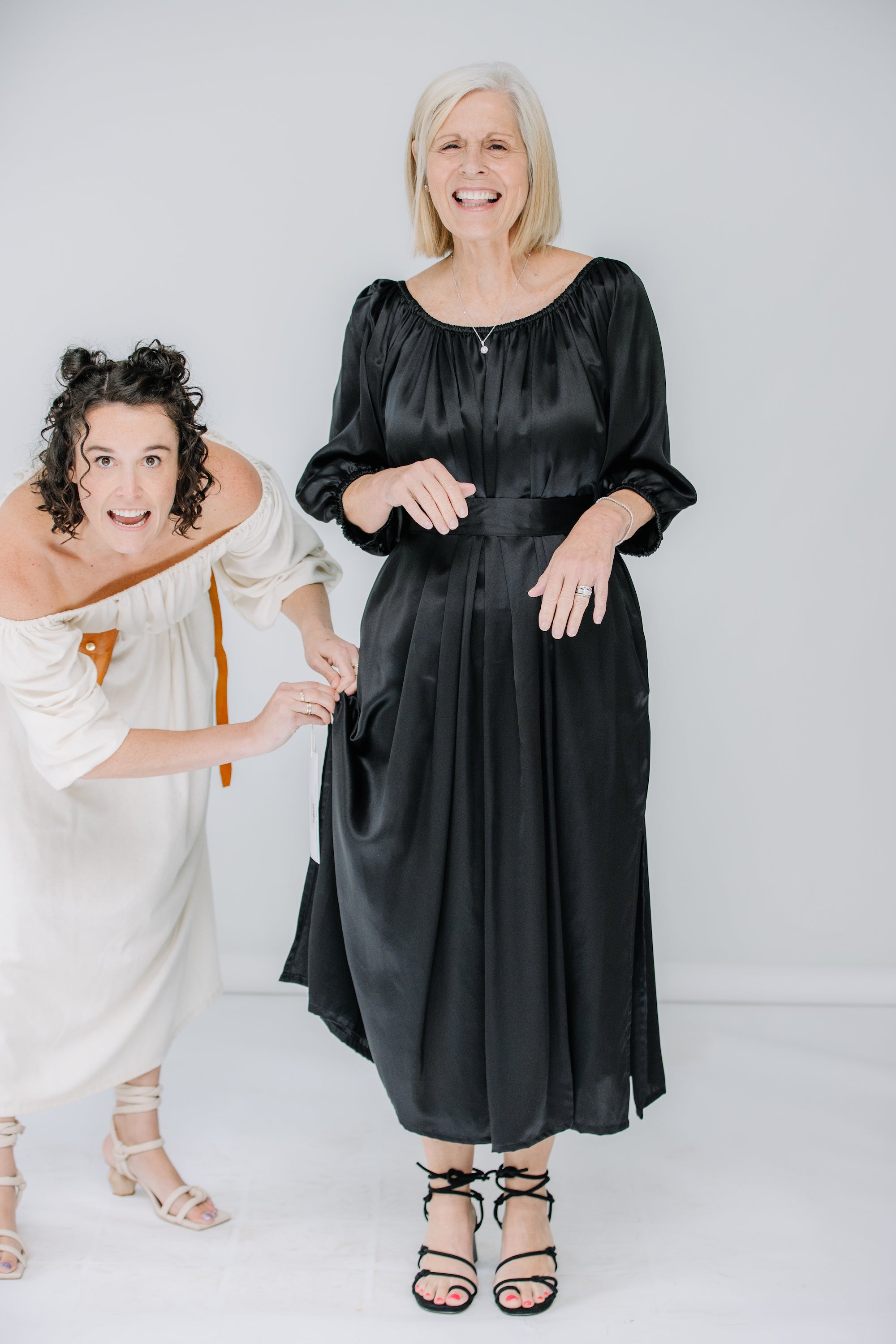 jules and lacey wear the cassatt dress in raw silk in natural, and venita wears the cassat dress in black silk charmeuse. dresses by miranda bennett studio