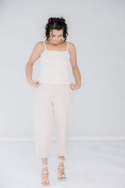 lacey models the lingua franca crochet flower tank in ivory. she is wearing kaarem sua trousers in cream with corresponding alohas sandals.
