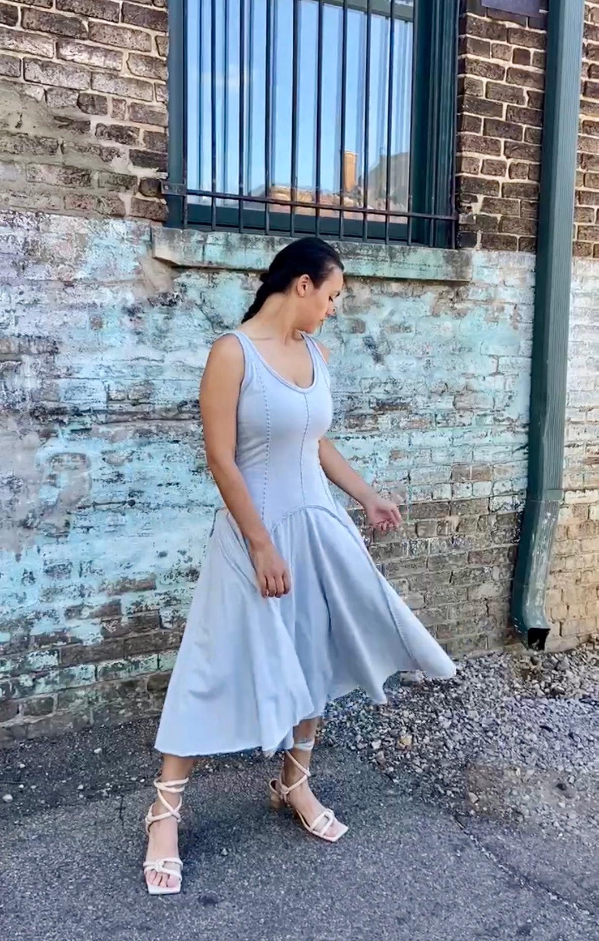 phoebe has dark brown hair and wears the alabama chanin hand sewn cynthia tank dress with a dropped waist in sky blue organic cotton