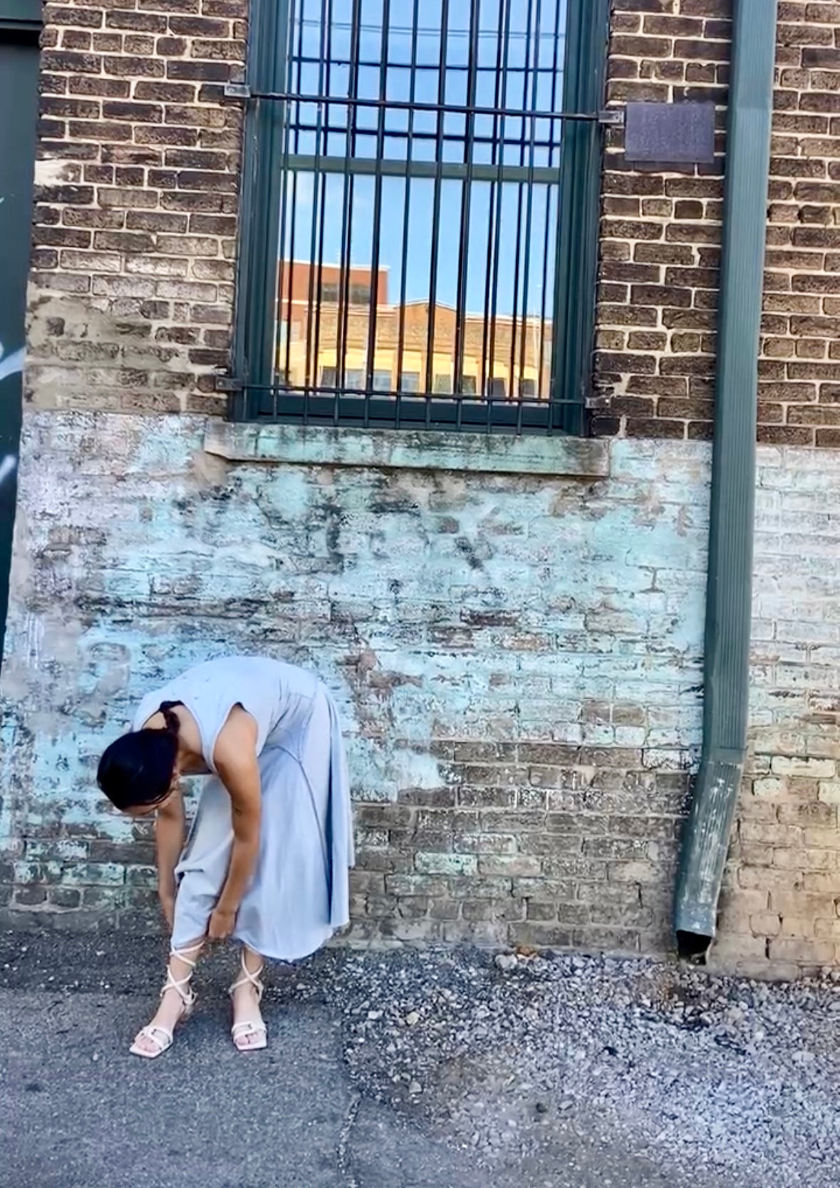 phoebe has dark brown hair and wears the alabama chanin hand sewn cynthia tank dress with a dropped waist in sky blue organic cotton