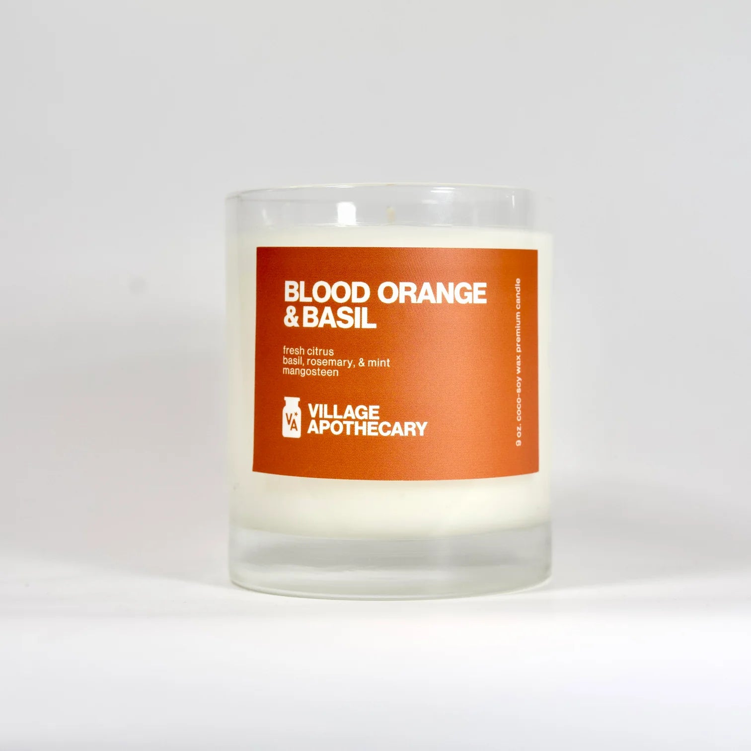 blood orange and basil candle from village apothecary has fresh citrus, basil, rosemary, mint, and mangosteen.