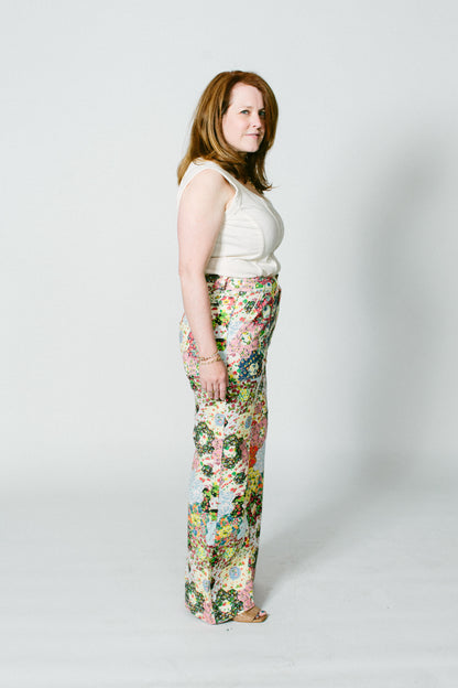 marisa, a white woman, wears the alabama chanin ivory corset top with some over the top floral rachel antonoff pants.