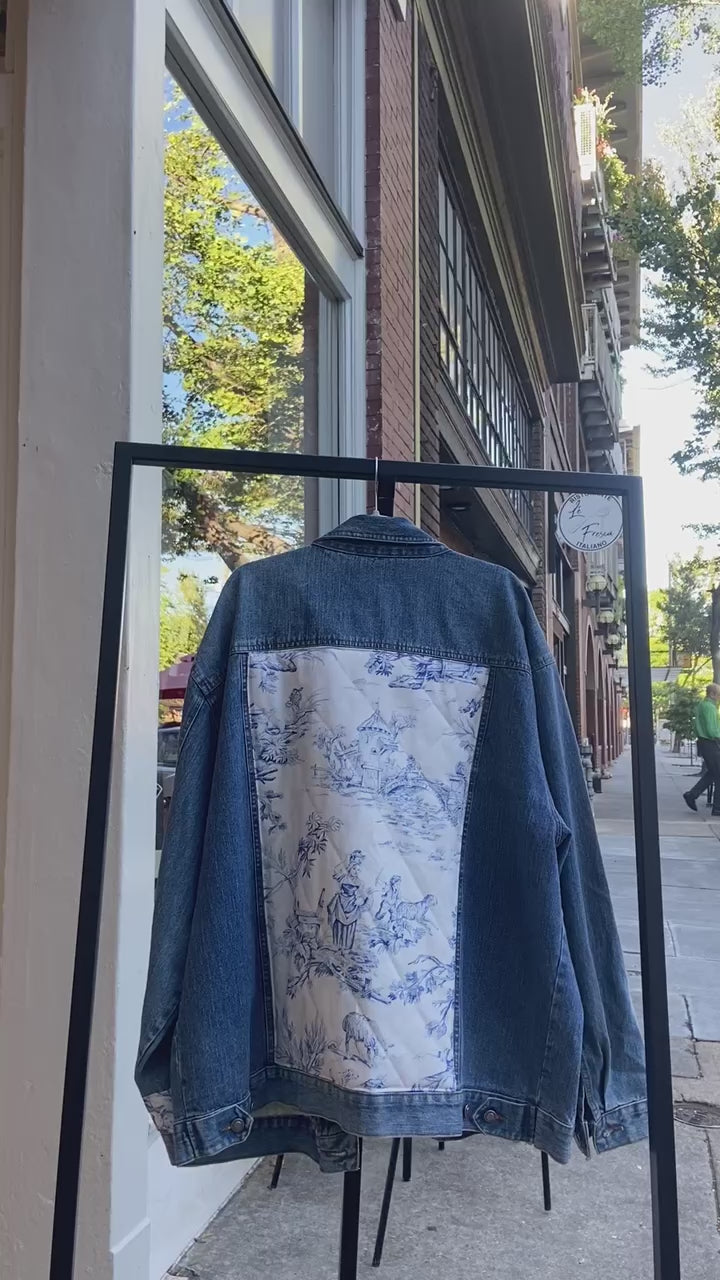 one of a kind upcycled denim jacket with an indigo and white quilted toile panel down the back center