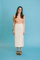 lacey wears the ajaie alaie transitional mother of pearl skirt with a megan huntz top and about arianne mina pumps | a basic shop