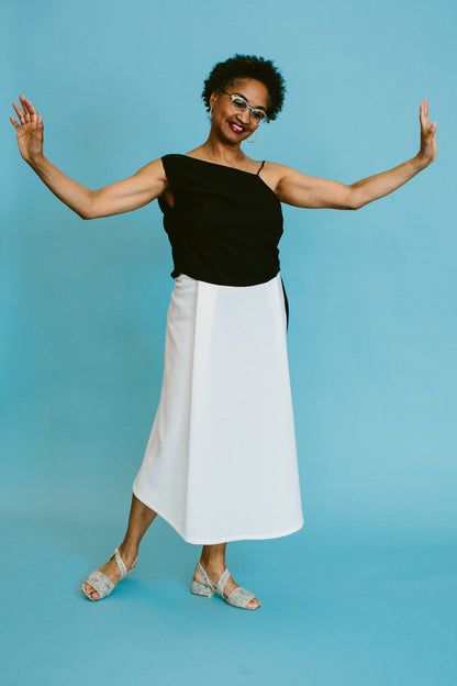 valerie wears the kaarem stream midi skirt with the shaina mote pisa top and about arianne selva sandals | a basic shop